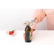 Load image into Gallery viewer, Brabantia Profile Universal Opener - Matt Steel, in use opening oil bottle. 
